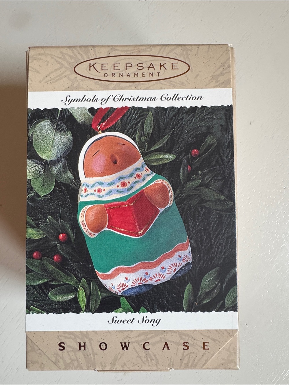Hallmark Showcase Sweet Song Caroler Christmas Ornament in Green, Red, and White